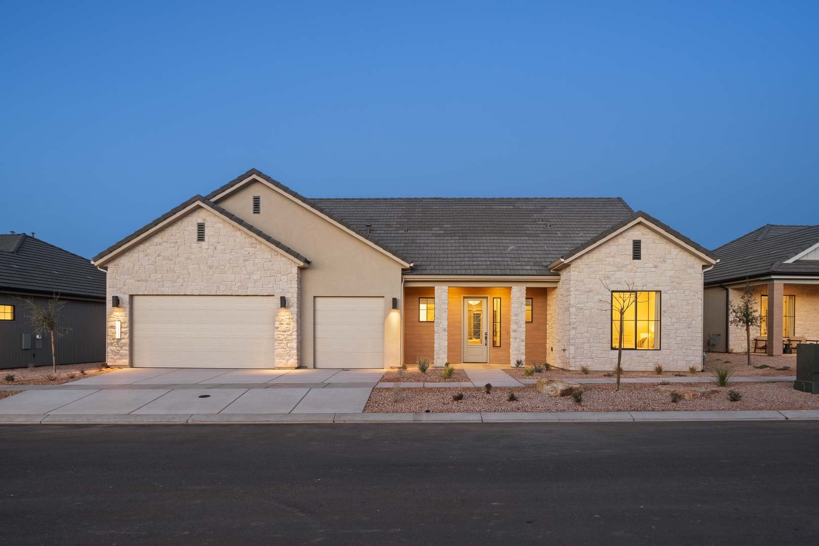 Evergreen by SunRiver Firelight Construction — Front Exterior at Dusk, 152 South Cottonwood Drive, Toquerville
